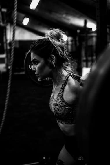 Person performing dumbbell exercise